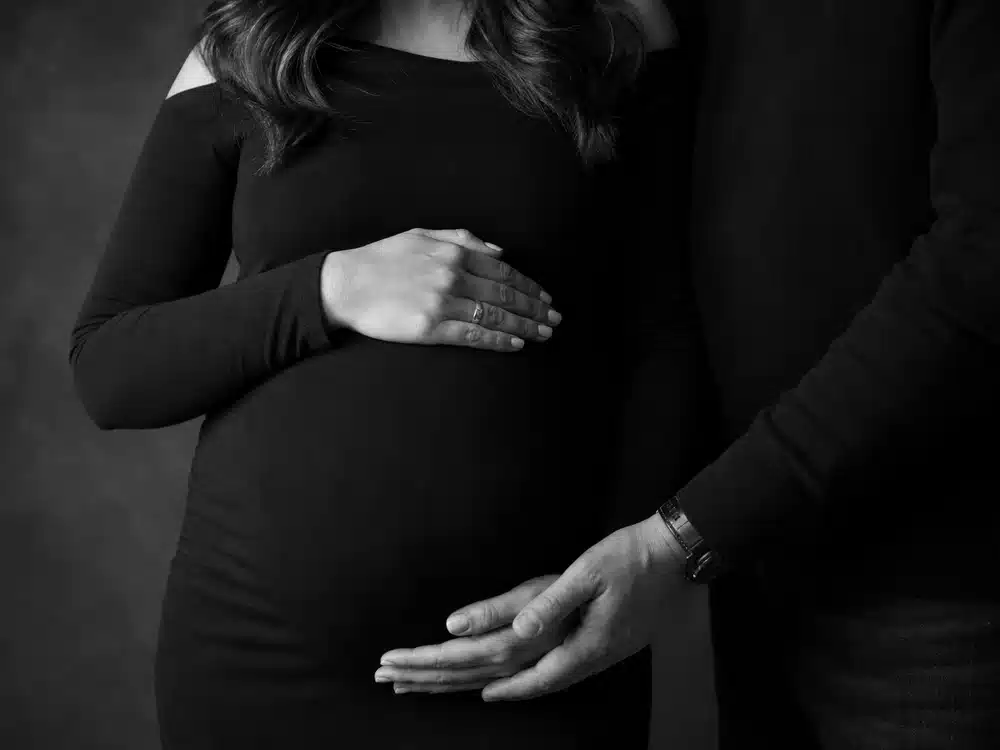 Audra Mari pregnancy announcement imagery recalls the couple sharing baby girl news.
