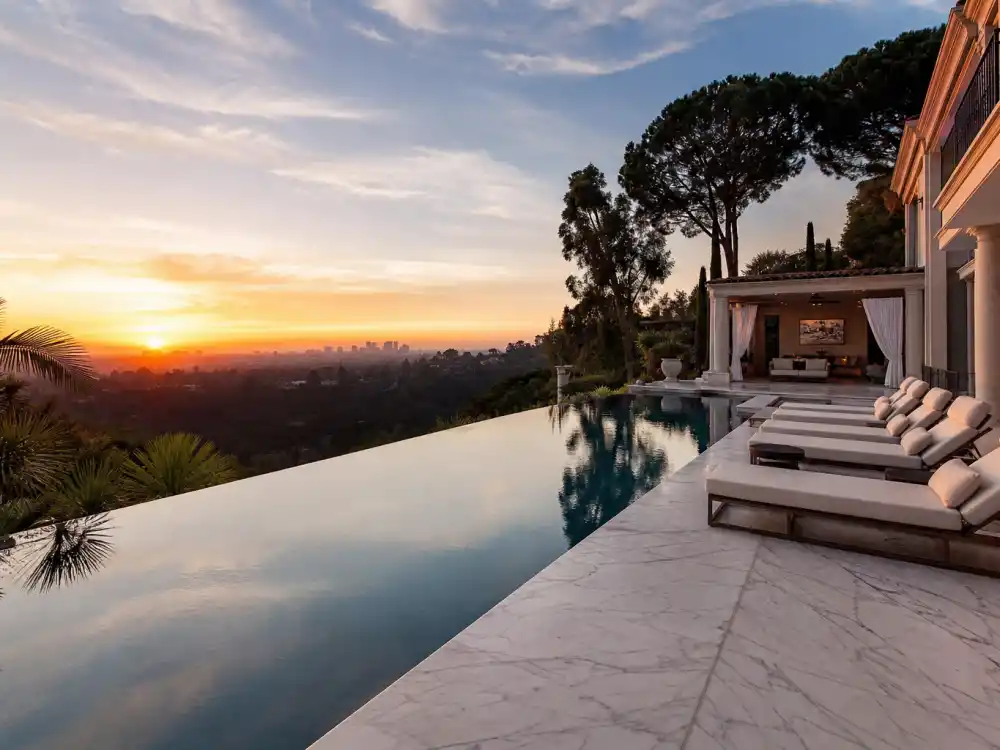 Pool deck and canyon view at a Beverly Hills mansion comparable to the Bruce Willis Beverly Hills home sold property