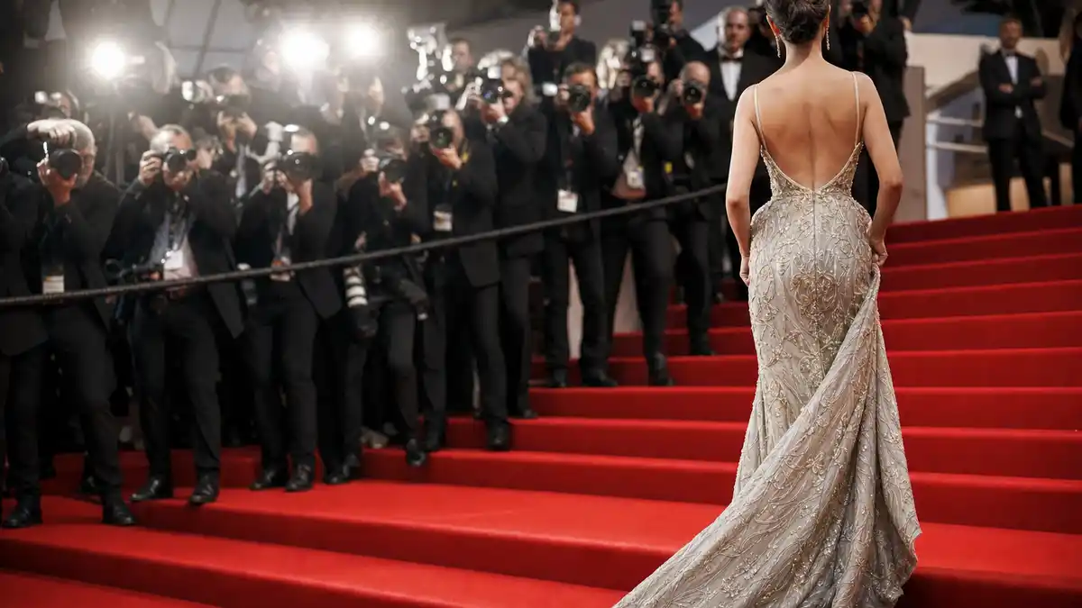 Cannes 2026 red carpet steps with an anonymous gown seen from behind.