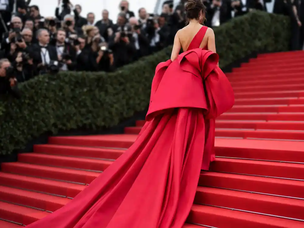 Sculptural red gown silhouette for Cannes 2026 red carpet fashion coverage.