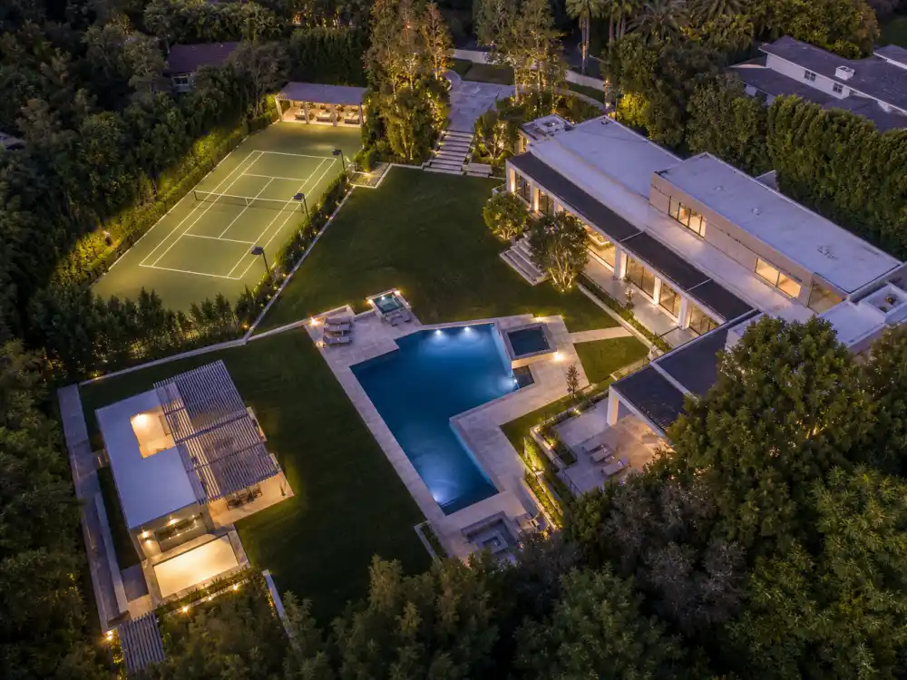 Aerial view of a private tennis court and pool inside an estate of one of the celebrities who live in Bel Air