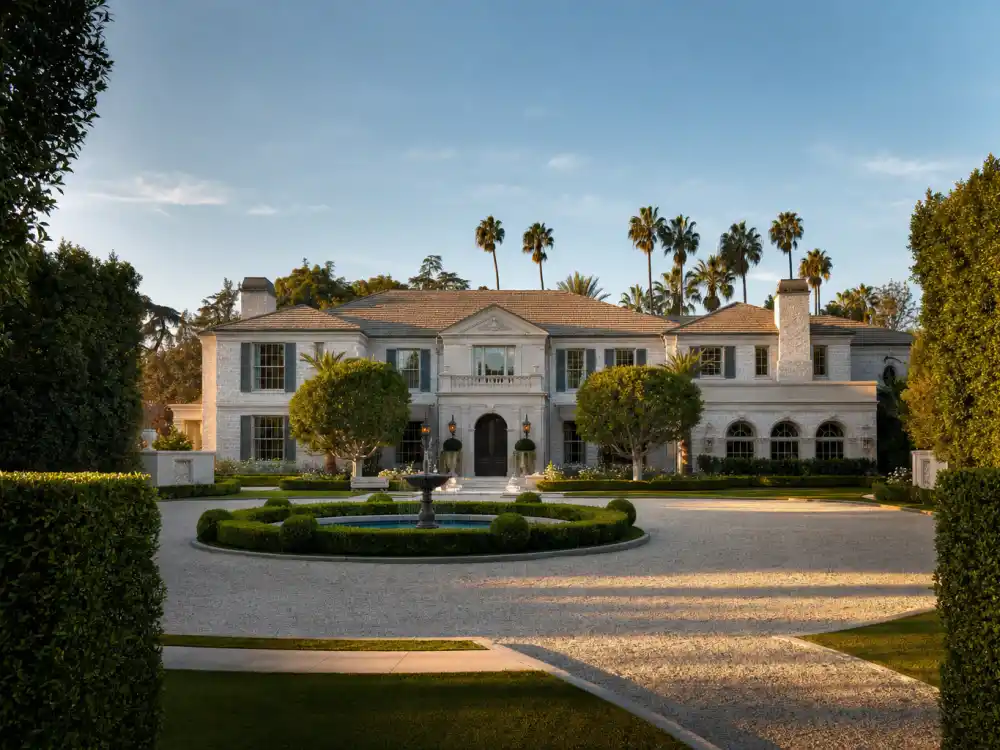 Long palm-lined driveway leading to an estate of one of the celebrities who live in Beverly Hills