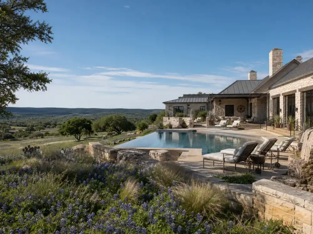 Modern Texas Hill Country estate with limestone facade and oak trees representing the celebrities who moved to Texas