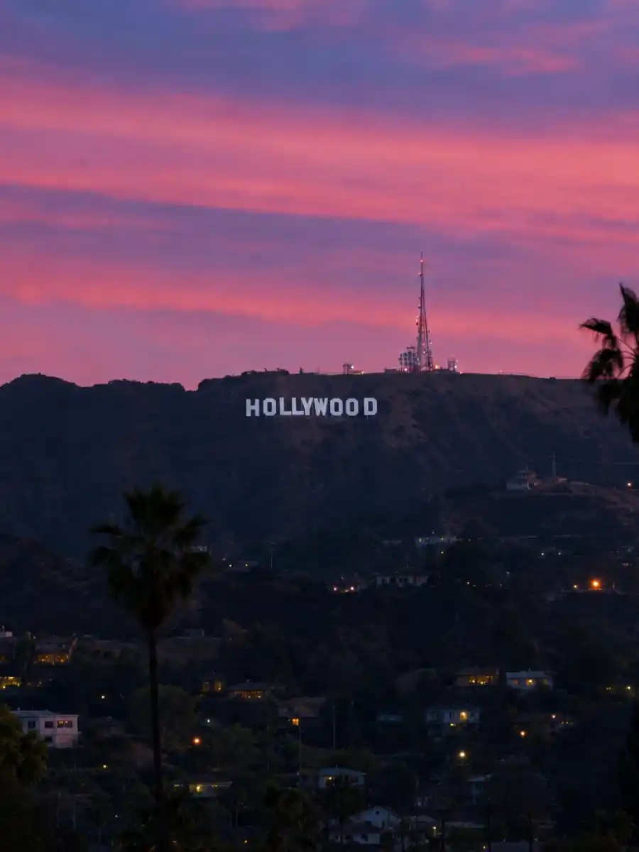 Poster for web story about celebrity couples who got together in 2026 with Hollywood backdrop