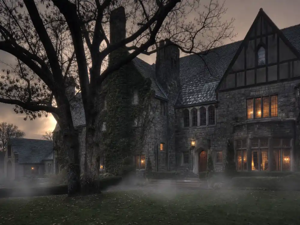 Old Hollywood Tudor mansion exterior in fog from celebrity haunted houses