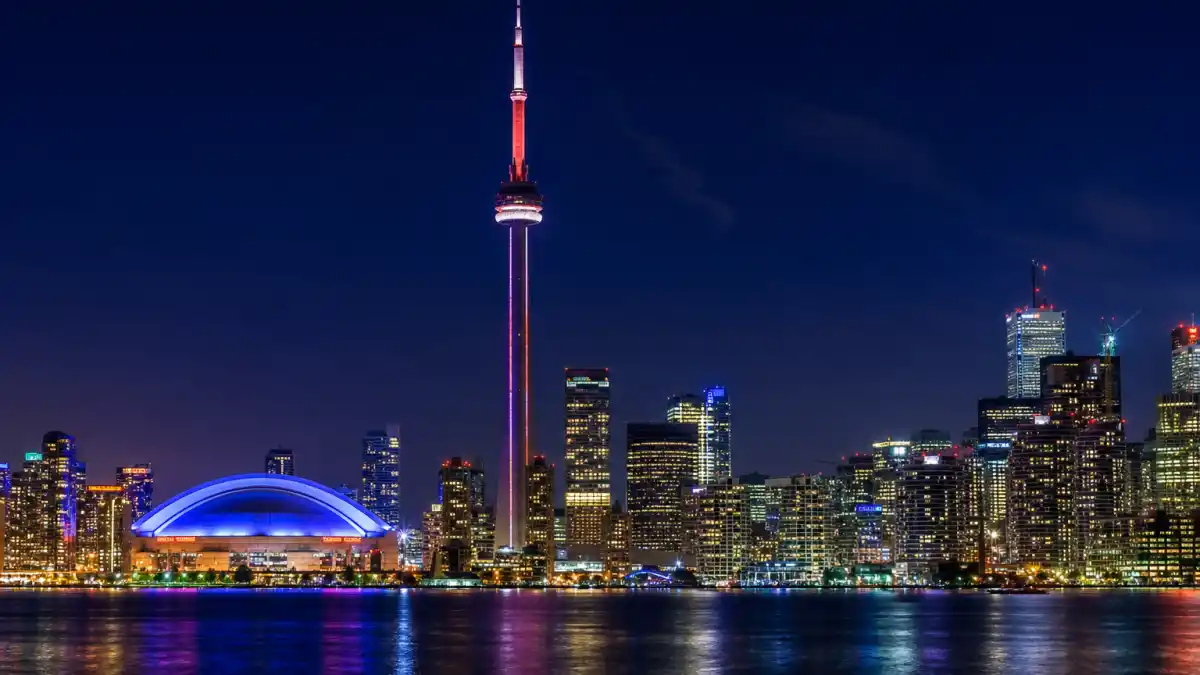 Toronto skyline at night with the CN Tower illuminated, the hometown where fans ask who is Drake dating 2026