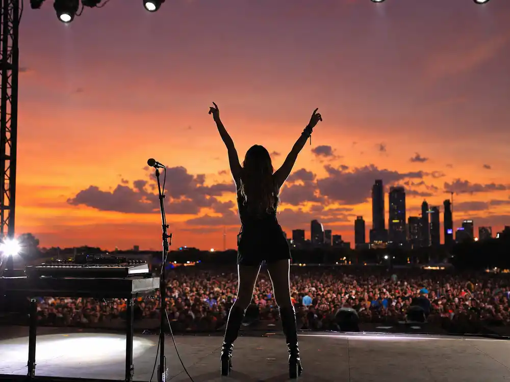 Performer silhouette on stage at Austin City Limits music festival at sunset