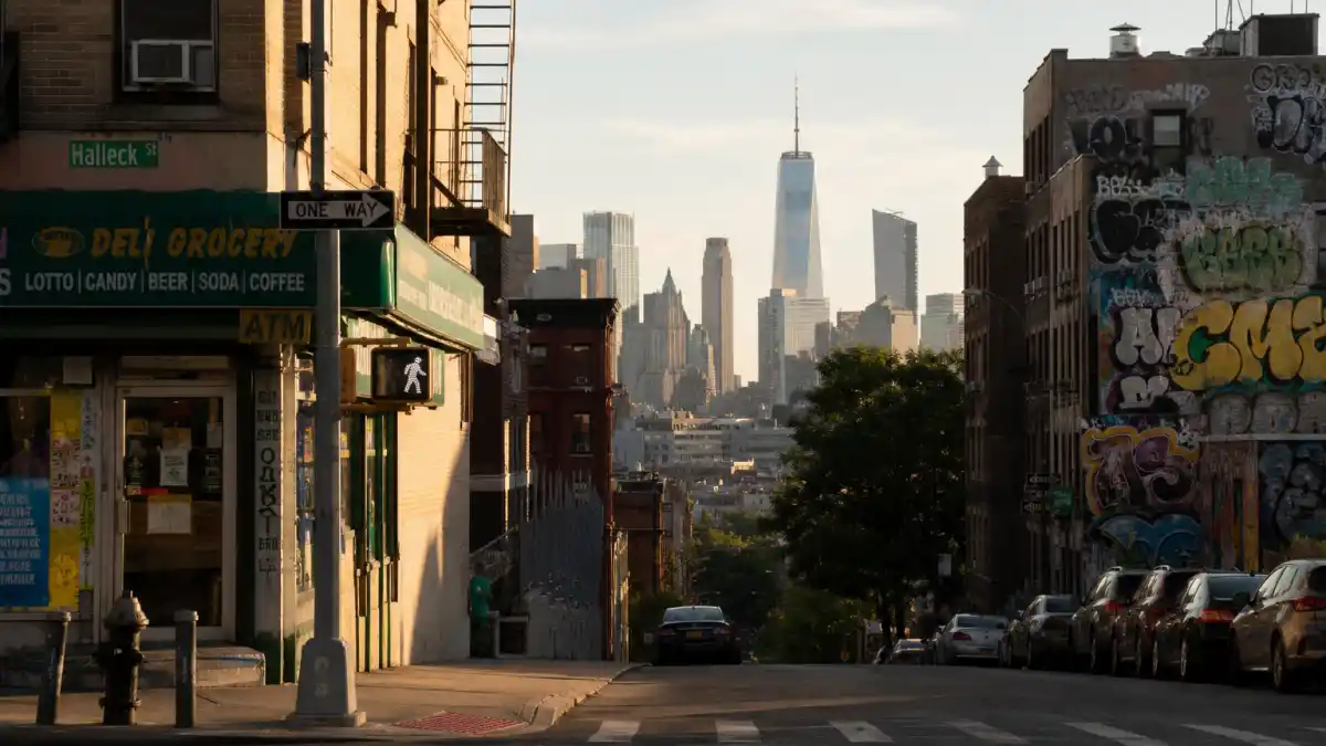 Bronx street corner with graffiti art and NYC skyline where Ice Spice grew up before dating rumors in 2026