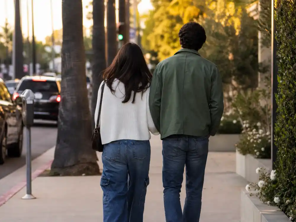 A low-profile couple walking in Los Angeles illustrates Alyce Huckstepp and Jamie Foxx baby coverage.