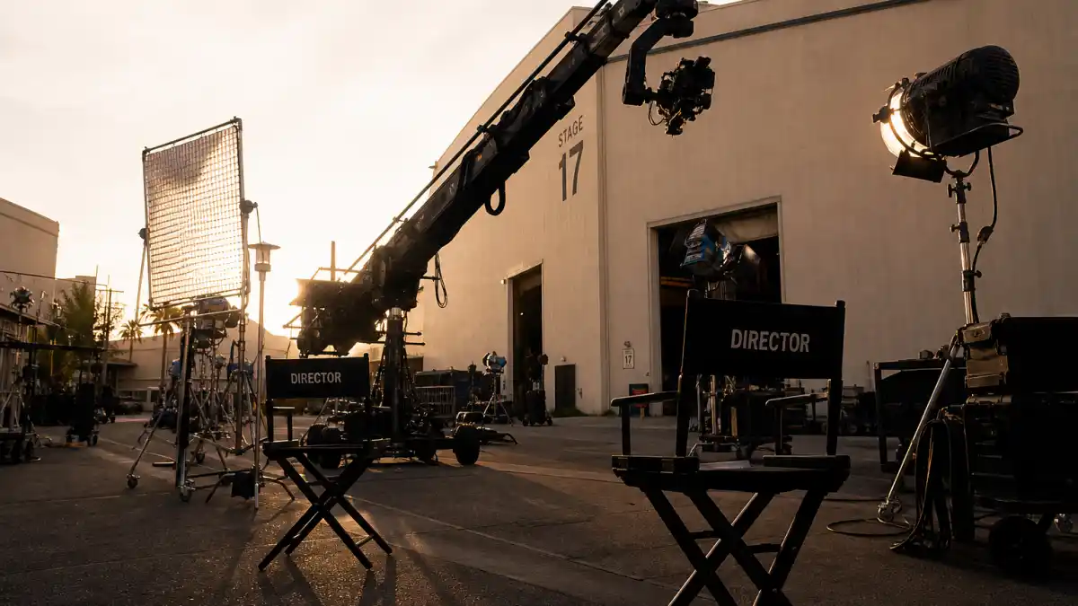 Hollywood studio backlot with filming equipment where stars like Jenna Ortega work on major productions
