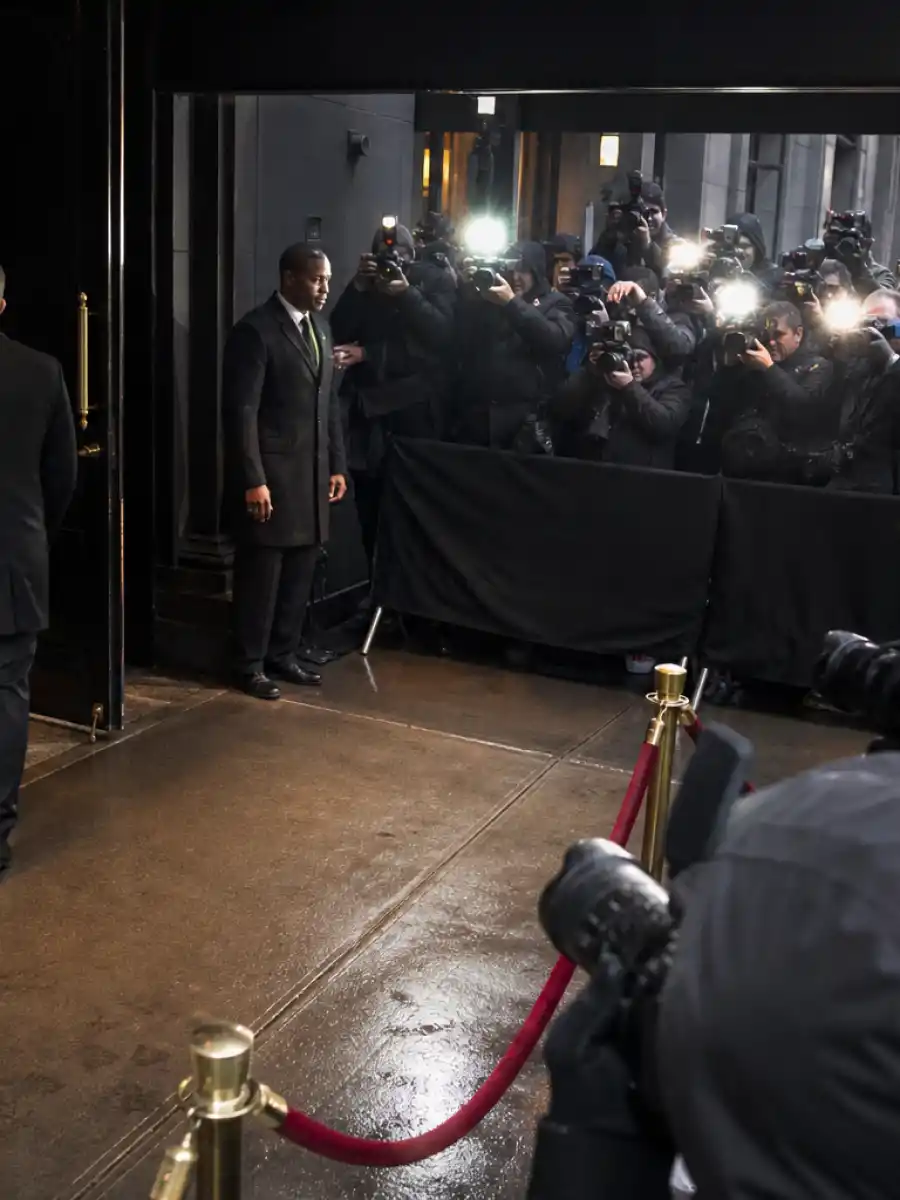 Jennifer Lopez pap walk staged-paparazzi debate illustrated by cameras outside a hotel.