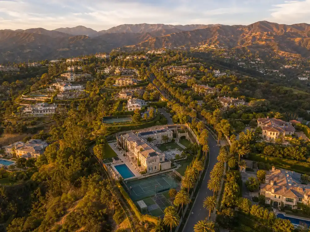 Justin Bieber house Beverly Park gated celebrity enclave aerial at sunset