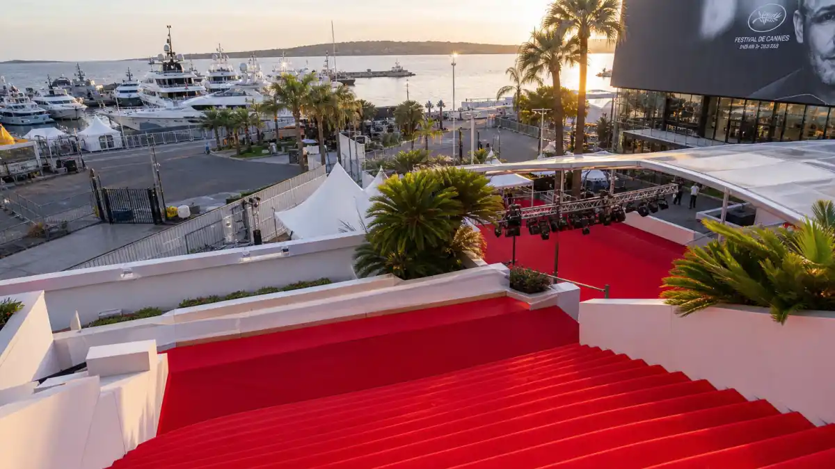 Cannes Film Festival red carpet with yacht harbor — a setting synonymous with Leonardo DiCaprio dating history