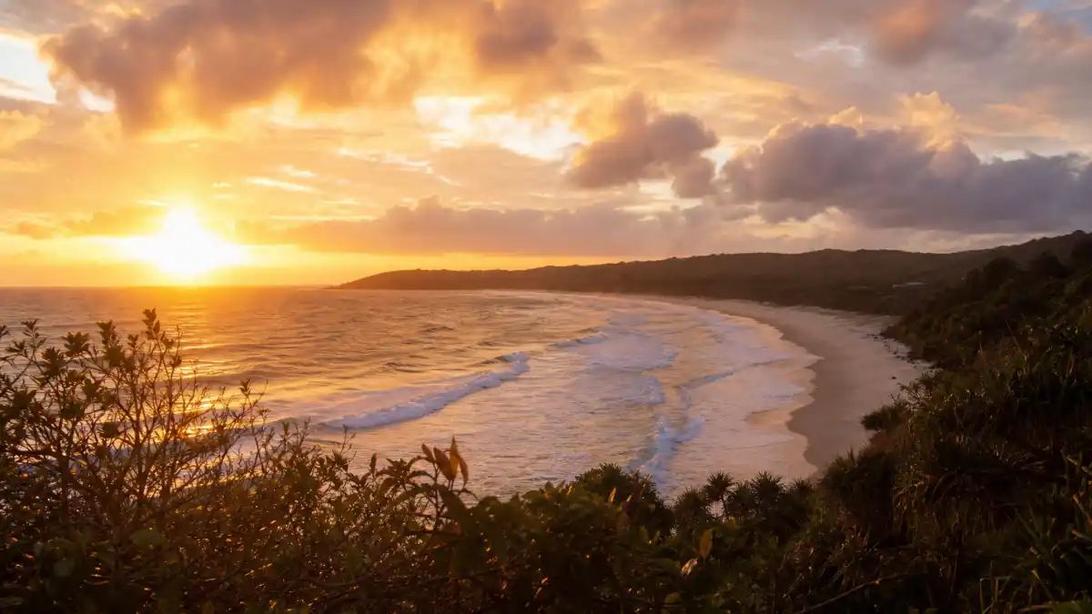 Golden sunset over Byron Bay beach in Australia where Margot Robbie married Tom Ackerley