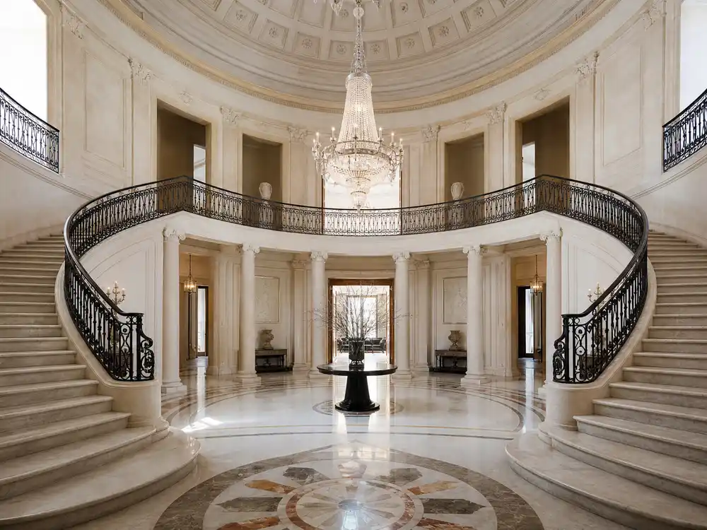 Mark Wahlberg house Florida marble foyer with curved double staircase and crystal chandelier