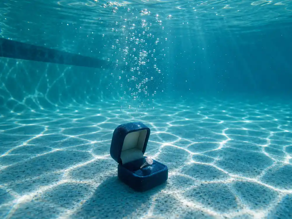 Underwater swimming pool with engagement ring box representing Millie Bobby Brown underwater proposal to Jake Bongiovi