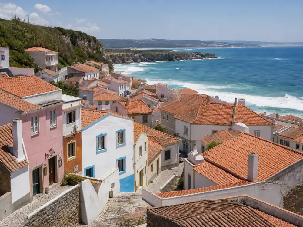 Colorful Portuguese coastal village similar to where Alba Baptista grew up in Lisbon