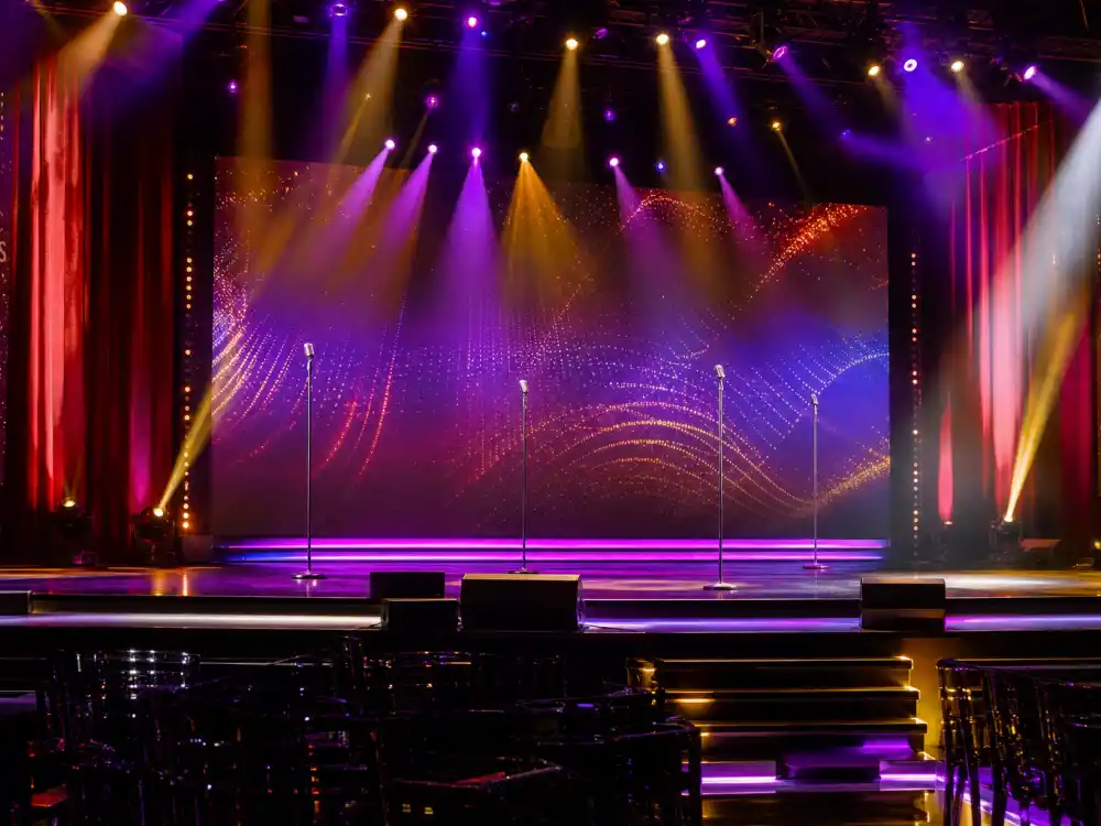 Music awards stage with dramatic lighting where Rihanna relationships often made headlines