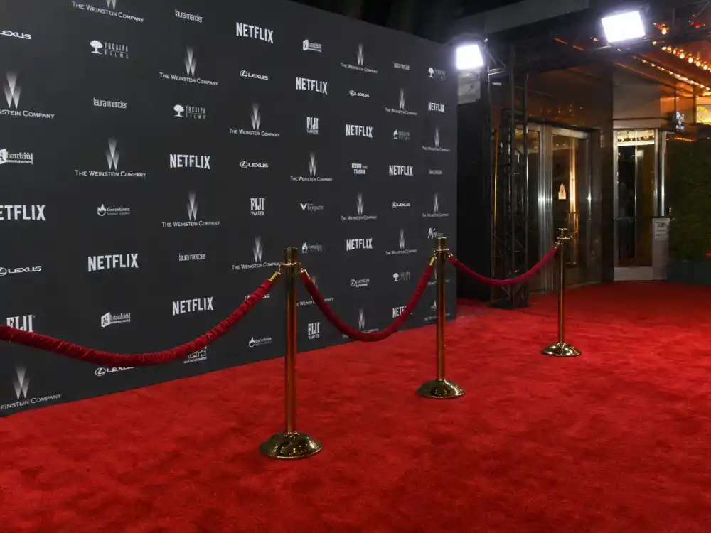 Red carpet event backdrop with velvet ropes where Selena Gomez and Benny Blanco made public appearances