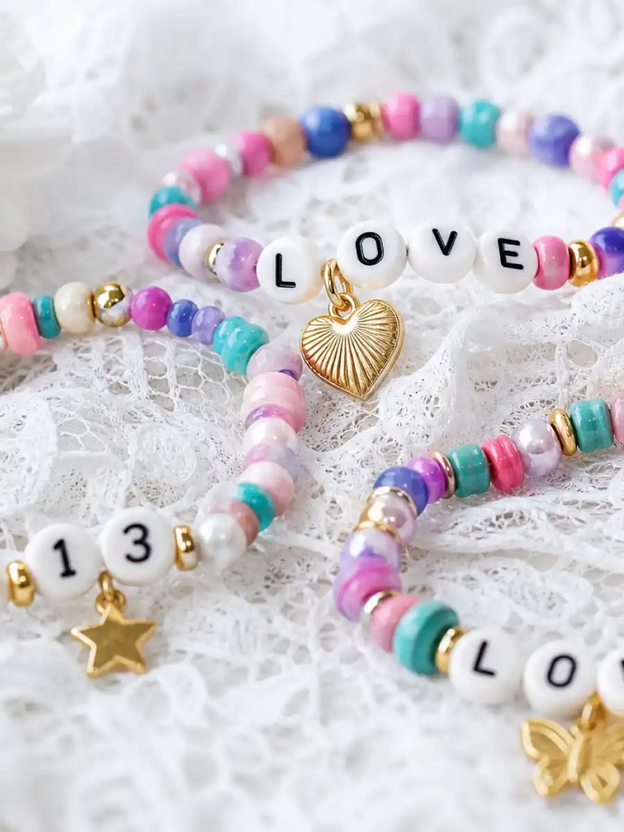 Friendship bracelets on white lace representing the Taylor Swift Travis Kelce wedding love story