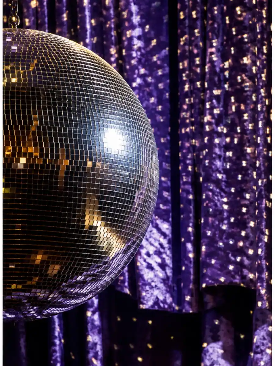 Web story poster of a sparkling mirrorball representing the Tess Daly Vernon Kay split US explainer for American audiences