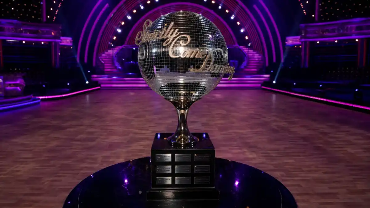 Strictly Come Dancing-style mirrorball trophy on a darkened ballroom stage symbolising the Tess Daly Vernon Kay split announcement