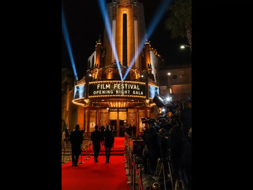 Movie premiere entrance with spotlights where Timothee Chalamet attends Hollywood film events