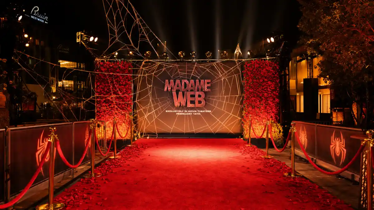 Red carpet premiere with spider web design elements celebrating Zendaya Tom Holland relationship