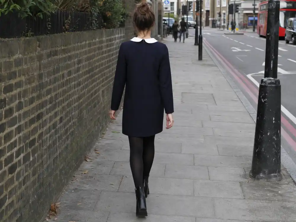 Navy shift dress with white Peter Pan collar and ankle boots central to Alexa Chung street style inspiration mod codes
