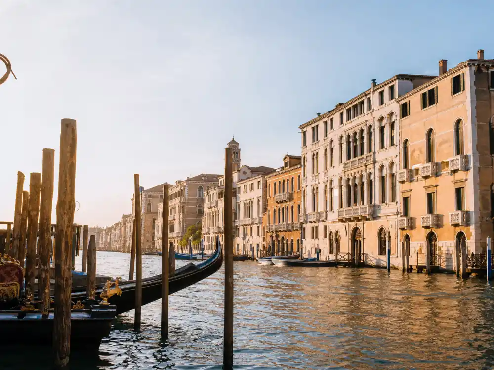 Venice canal palazzos and golden-hour waterfront where Amal Clooney wedding dress Oscar de la Renta made its September 27 2014 destination ceremony debut