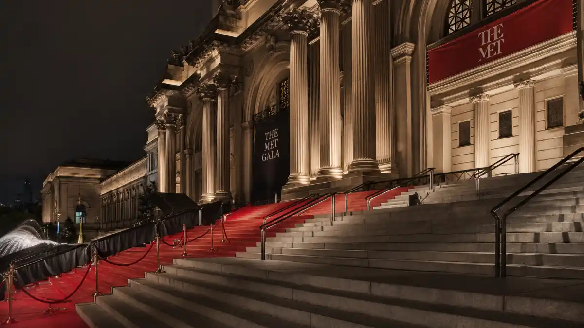 Anna Wintour Met Gala role explained — Metropolitan Museum grand staircase with red carpet before the first Monday in May arrivals