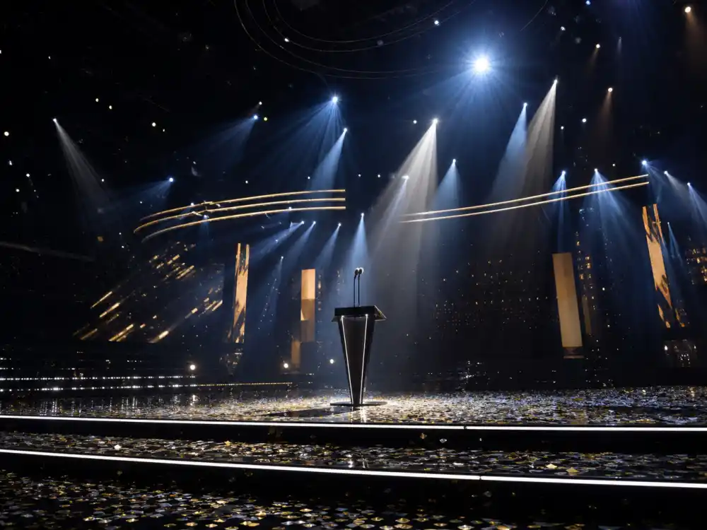 Empty arena stage with golden spotlights frames the ceremony nights that build artists with most Grammy nominations ever totals