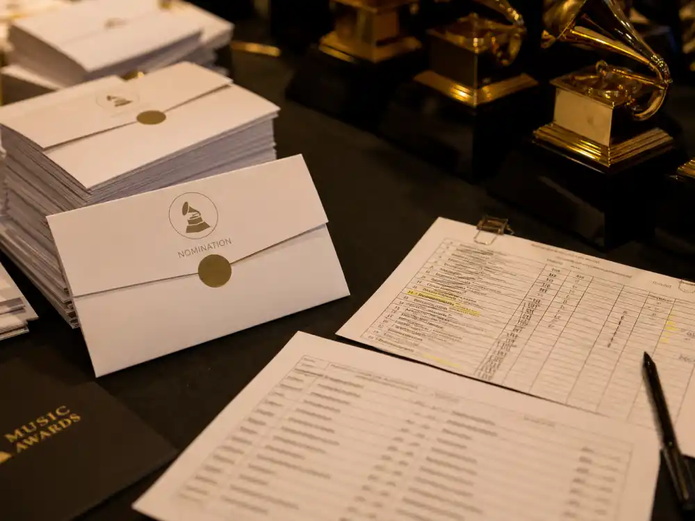 Nomination envelopes on a backstage table symbolize the tally race among artists with most Grammy nominations ever before winners are announced