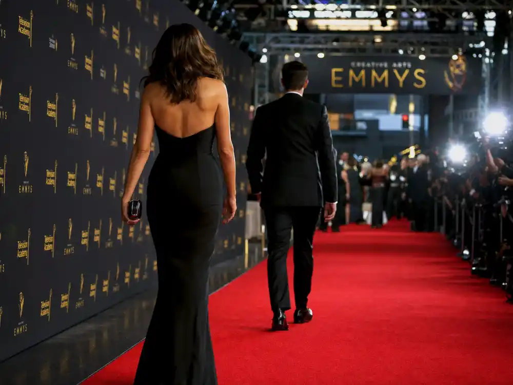 Red carpet arrival timing at an awards show step-and-repeat — red carpet pacing is part of award show etiquette rules celebrities follow before the telecast