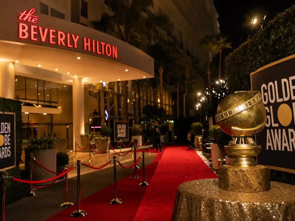 Beverly Hilton style ballroom with golden globe trophy for awards season 2027 calendar all dates Golden Globes January ceremony slot