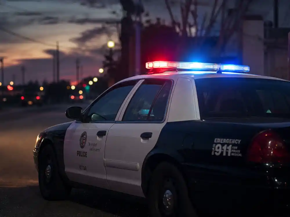 LAPD patrol car at dusk for Ben McKenzie Southland years as Officer Ben Sherman
