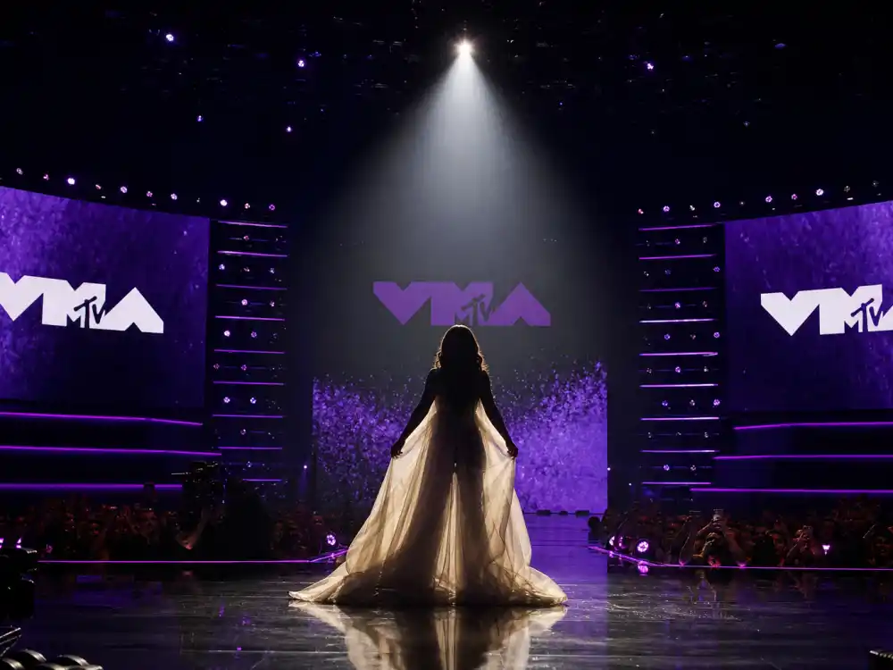 Beyoncé pregnancy reveal ranks among the best VMA performances of all time — dramatic VMA stage spotlight moment with flowing costume silhouette