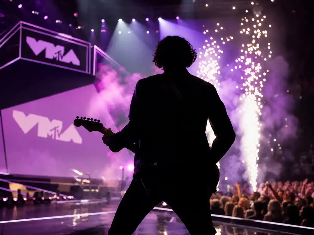 Prince guitar solo at the MTV VMAs belongs on any best VMA performances of all time list — electric guitar silhouette under purple pyrotechnics