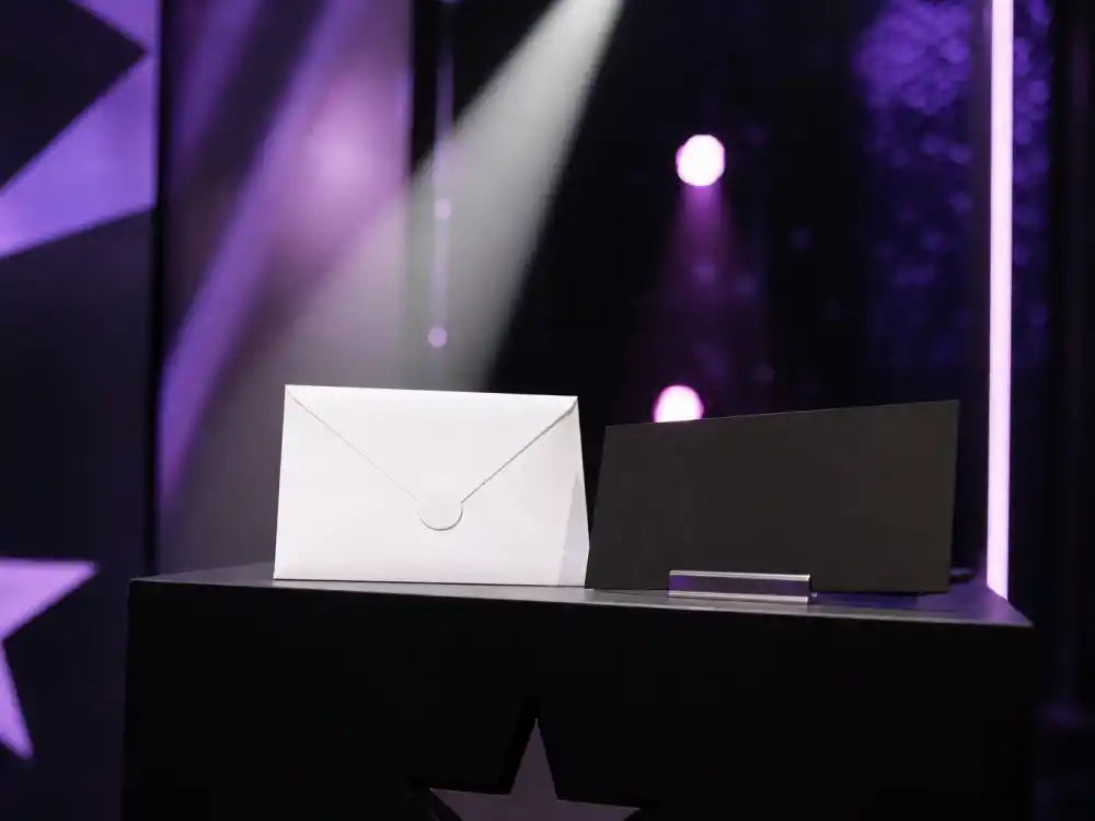 Sealed envelope on podium beside blank winner placard before June ceremony when BET Awards 2026 winners list goes live