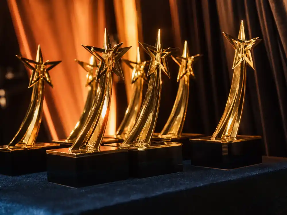 Golden BET Award statuettes on display backstage evoke every category on the BET Awards 2026 winners list before envelopes open live