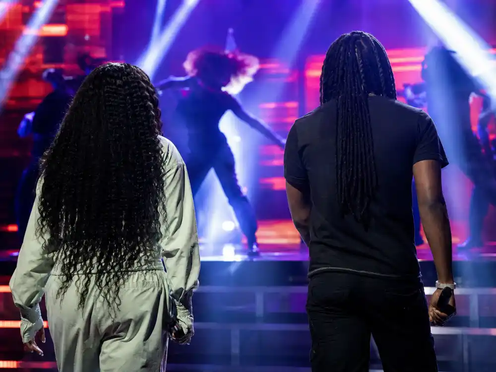 Backup dancer silhouettes on a BET Awards style stage capture the live performance energy readers expect in the BET Awards performances recap 2026