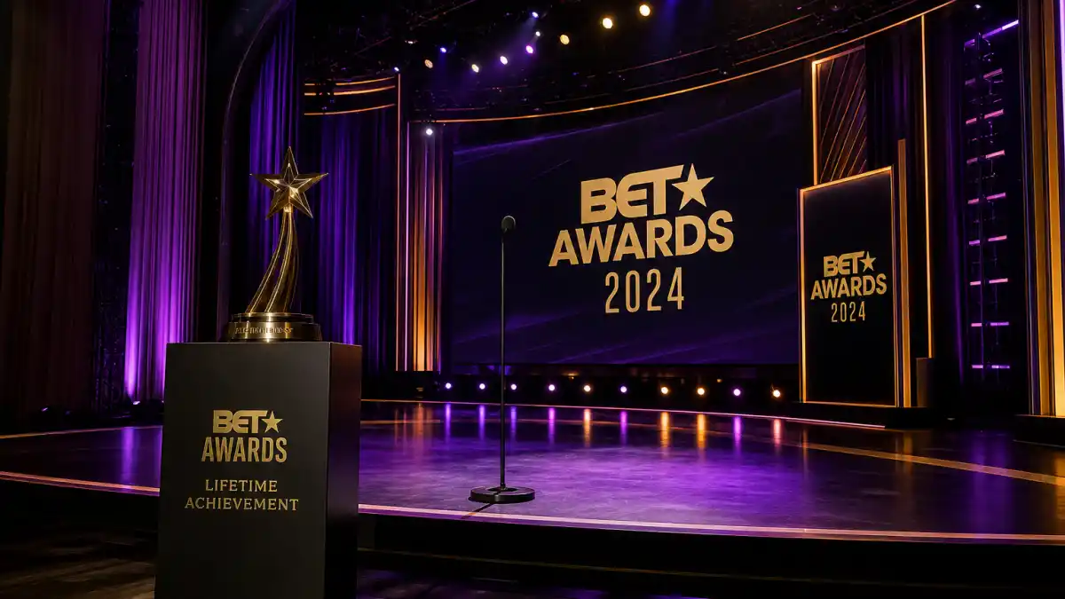 BET Lifetime Achievement Award winners — purple and gold Peacock Theater stage with lifetime achievement trophy pedestal