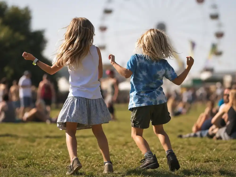 Children dancing on festival grass seen from behind in Beyonce Coachella kids cameo explained — visual shorthand for Homecoming rehearsal dance cameos without faces