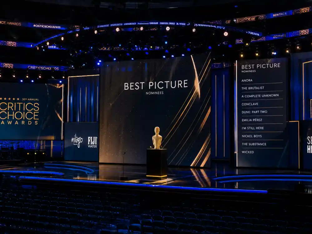Modern awards arena stage with LED screens reflects how the biggest Grammy snubs of all time still dominate social media every February