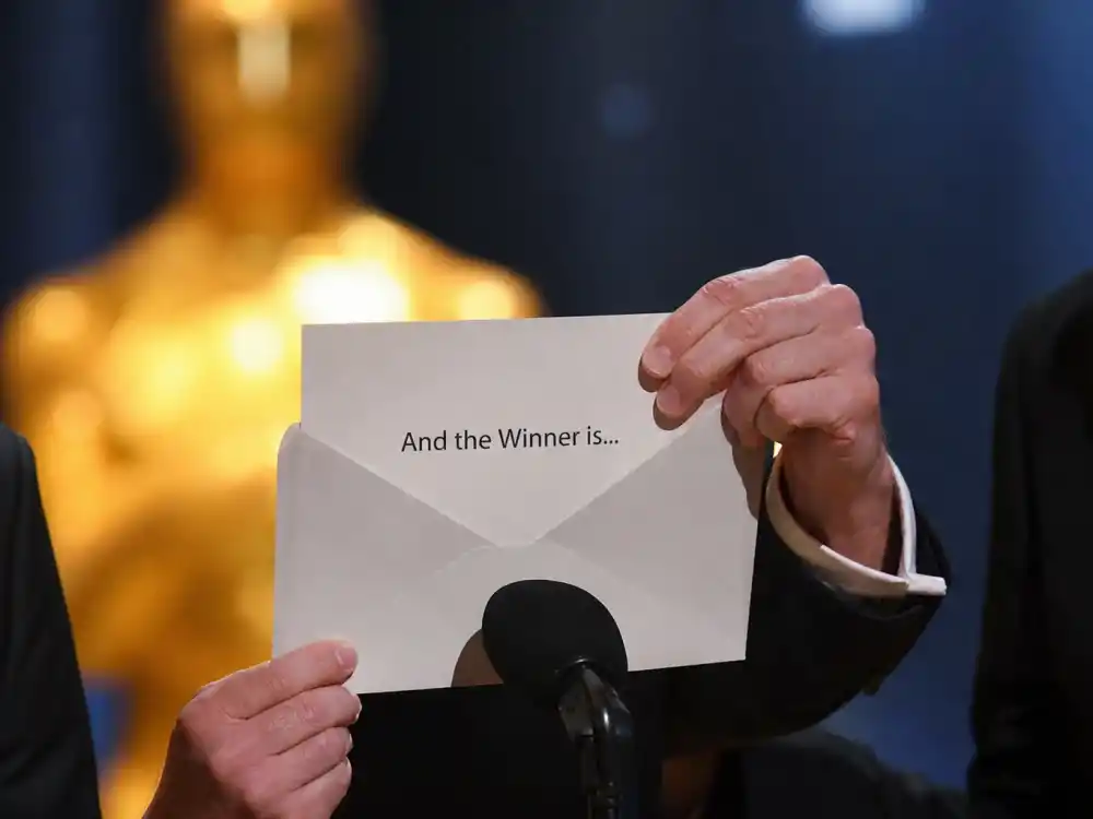 Envelope chaos on the awards podium symbolizing the biggest Oscar upsets in history and ceremony-night surprises