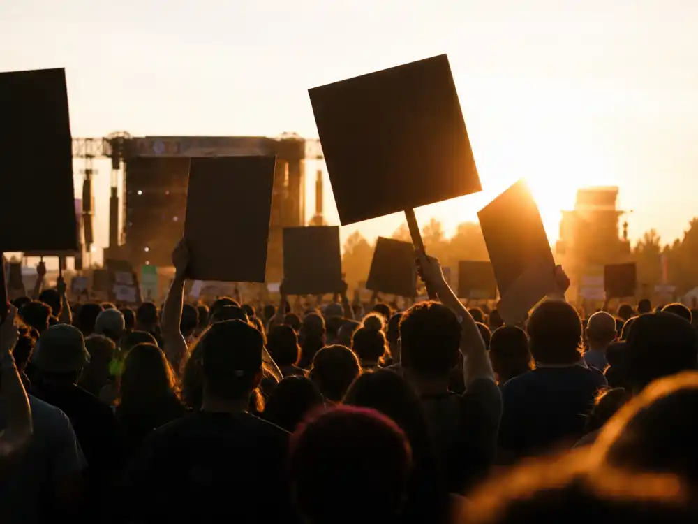 Silhouetted concert crowd reactions mirror fan outrage when the biggest Rock and Roll Hall of Fame snubs dominate nomination morning headlines