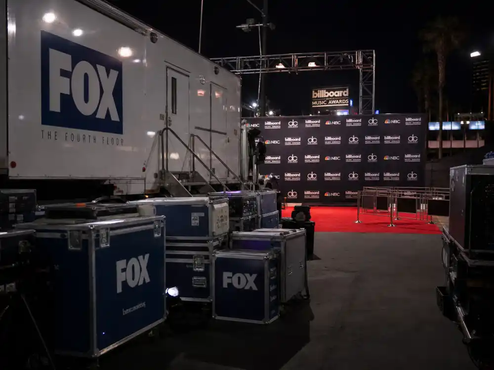 Fox broadcast production truck at a Billboard Music Awards 2026 winners predecessor telecast with step-and-repeat signage