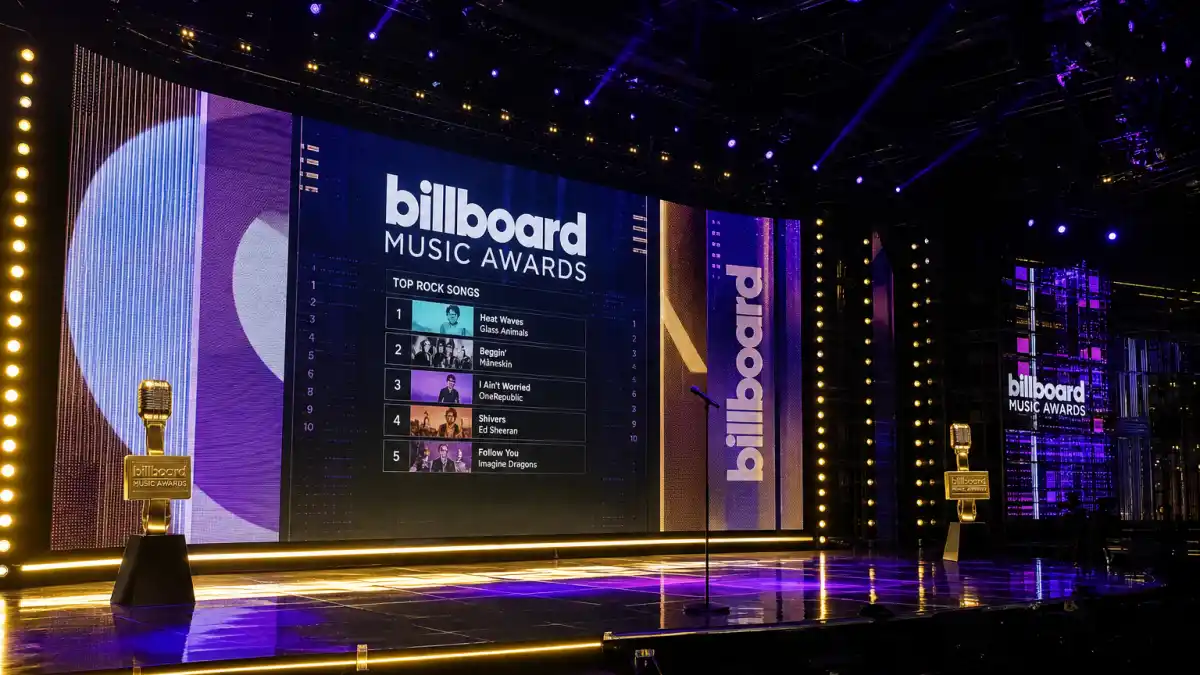 Billboard Music Awards 2026 winners — purple and gold ceremony stage with chart LED screens awaiting the next Fox telecast