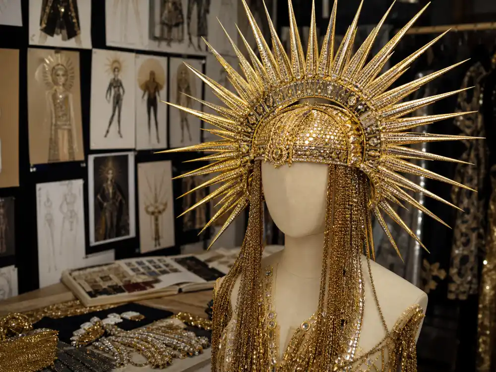The Blonds atelier gold Sun God headpiece on mannequin defining Billy Porter sundial hat Met Gala couture construction and camp Egyptian craftsmanship