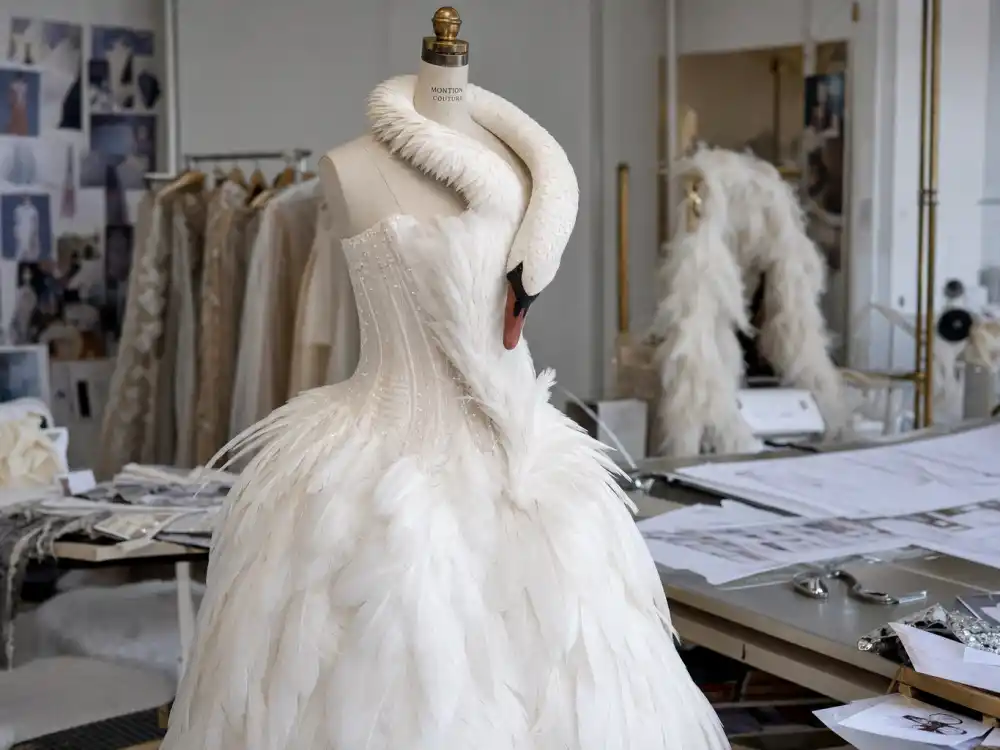Marjan Pejoski atelier white swan dress on couture mannequin defining Bjork swan dress Oscars history construction and feather engineering